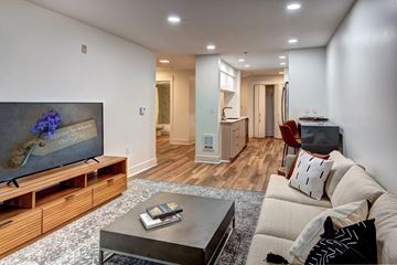 Seattle apartment for rent - A living room with a television and a couch.