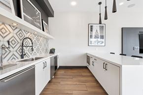 Oakland apartment for rent - A modern kitchen with a white and wood color scheme.