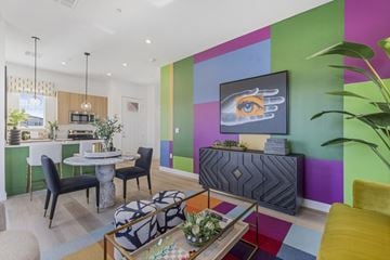 Henderson apartment for rent - A modern living room with a dining table and chairs.