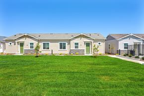 Roseville townhouse for rent - A row of houses with green lawns in front.