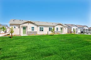 Roseville townhouse for rent - A row of houses with green lawns in front.