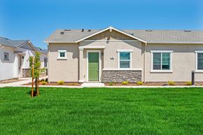 Roseville townhouse for rent - A house with a green lawn in front.
