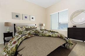 Valencia apartment for rent - a bedroom with a bed and a dresser and a window at 55+ FountainGlen Valencia, California, 91354