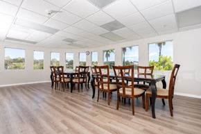 Valencia apartment for rent - community clubhouse with table and chairs at 55+ FountainGlen Valencia, Valencia, California