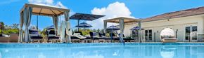 Valencia apartment for rent - a swimming pool with chairs and umbrellas at 55+ FountainGlen Valencia, Valencia, California