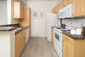 Murrieta apartment for rent - Modern kitchen with wooden cabinets setup at 55+ FountainGlen Grand Isle, California, 92562