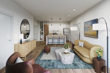 Fayetteville apartment for rent - A modern living room with a yellow sofa and a round mirror on the wall.