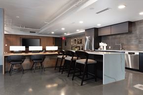 Oakland apartment for rent - a kitchen with a bar and chairs in front of a counter top