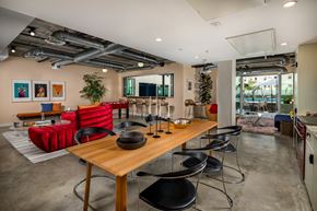 Los Angeles apartment for rent - A modern dining room with a wooden table and chairs.