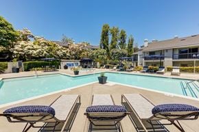 Dana Point apartment for rent - our apartments offer a swimming pool with tables and chairs at Harbor Pointe, California, 92629