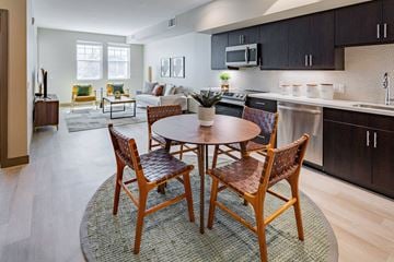 Burlingame apartment for rent - a living room and kitchen with a table and chairs