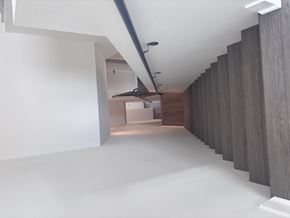 Corona townhouse for rent - Corona, CA, Pet-Friendly Townhomes - Dos Lagos Townhomes - An Indoor Staircase with Dark Stairs and Black Metal Handrail.