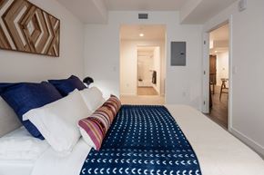Berkeley apartment for rent - A bedroom with a large bed and a painting on the wall.