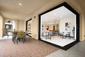 Los Alamitos apartment for rent - a large window in a room with a table and chairs