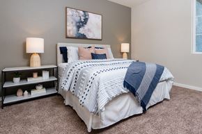 Henderson apartment for rent - bed and night stand at Miro at the Parc, Henderson, NV 89074