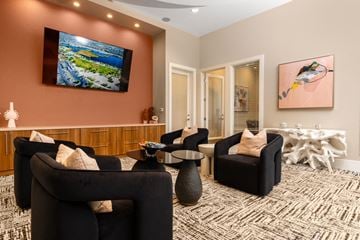 Henderson apartment for rent - A living room with a large television and comfortable seating.