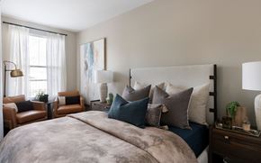 Napa apartment for rent - A bedroom with a large bed and a painting on the wall at Montrachet Apartments, Napa