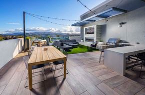 Walnut Creek apartment for rent - a terrace with a wooden table and chairs at NoMa Apartments, California, 94596