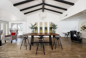 El Paso apartment for rent - A dining room with a wooden table and chairs.