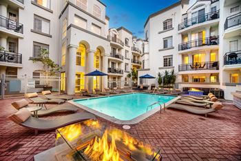 Resort swimming pool with lounge chairs with firepit