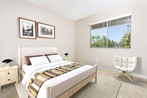 Upland apartment for rent - a bedroom with a bed and a chair