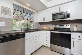 Lake Forest apartment for rent - Kitchen with bay window, stove, dishwasher and microwav at Ridgecrest, California, 92630e