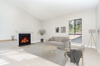 A living room with a couch and a fireplace