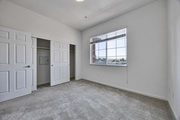 San Jose apartment for rent - an empty living room with white walls and a window