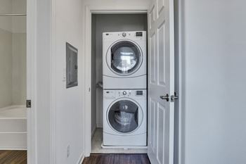 A front loading washer and dryer in a small laundry room