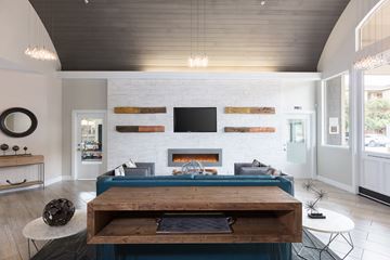 Napa apartment for rent - a living room with a blue couch and a fireplace