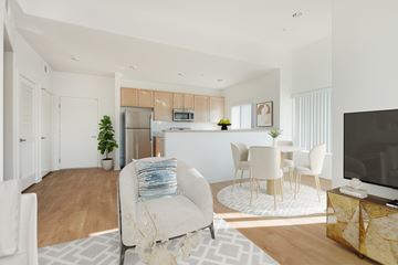 Los Angeles apartment for rent - A modern living room with a white sofa and a television.