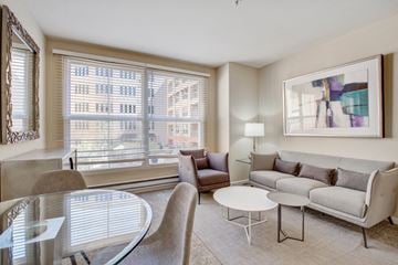 San Rafael apartment for rent - A living room with a glass table and a couch.