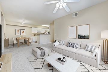 Upland apartment for rent - A living room with a white couch and a coffee table in the center.
