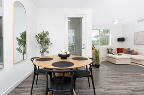 West Sacramento apartment for rent - A modern dining room with a round table and chairs.
