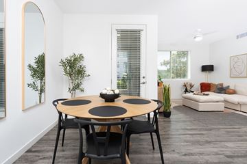 West Sacramento apartment for rent - A modern dining room with a round table and chairs.