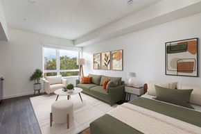 San Leandro apartment for rent - Living room staged photo with couch and paintings