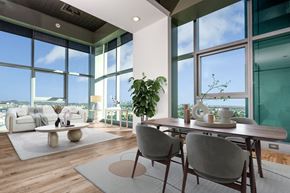 Los Angeles apartment for rent - A modern dining room with a table set for two and a view of the city.
