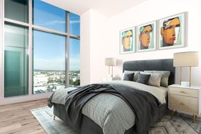 Los Angeles apartment for rent - Apartments In Hollywood, CA - Sunset Vine Tower - Spacious Bedroom With Wood-Style Flooring, Floor-to-Ceiling Windows With City Views, And Soaring 13-Foot Ceilings