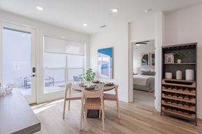 Sacramento apartment for rent - A dining room with a table set for two and a view of the balcony.