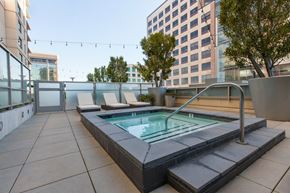 Oakland apartment for rent - A small pool on a balcony with a chair and a table