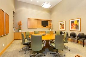 Oakland apartment for rent - A conference room with a long table surrounded by chairs at The Grand Apartments, Oakland, CA, 94612