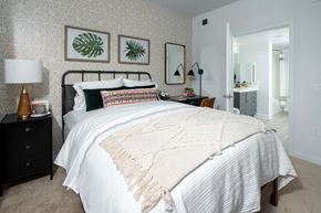 Corona apartment for rent - a bedroom with a bed and a bathroom with a sink