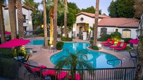 Surprise apartment for rent - Apartments for Rent Surprise, AZ - The Village at West Point - A Swimming Pool With Palm Trees, Pink Lounge Chairs, And Umbrellas.