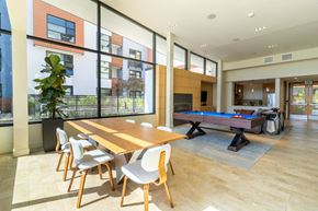 San Francisco apartment for rent - A room with a long table and chairs and a pool table.