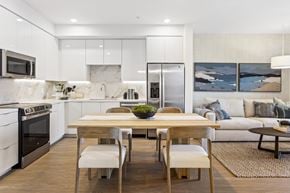 San Pedro apartment for rent - A modern kitchen with a dining table and chairs.