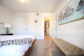 Scottsdale apartment for rent - One-Bedroom Apartments in Scottsdale - Winfield Scottsdale - View of a Spacious Modern Bedroom Featuring a Minimalist Style and Large Windows