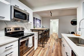 Kirkland apartment for rent - Kitchen with High Table and Chairs at Woodlake Apartments, Kirkland 98034