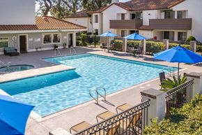 Alta Loma apartment for rent - Resort style pool with spa and blue umbrellas at Woodbend Apartments, Alta Loma