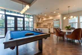 Danville apartment for rent - A pool table with a green felt cloth and white cue ball and red balls.