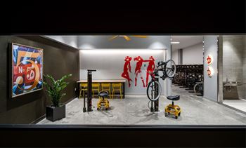 Secure, dedicated bicycle storage with an adjacent service workshop